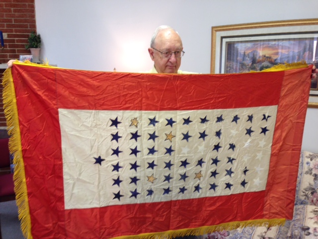 Howard Detweiler with WWII Service Banner.