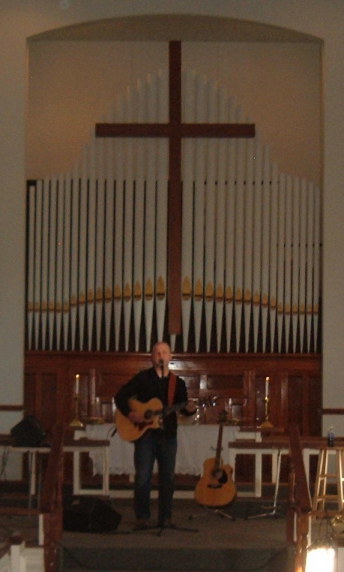 Kirby Stailey performing a musical ministry during Sunday morning worship.