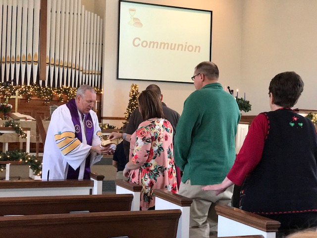 The congregation takes Communion at the Paoli United Methodist Church.