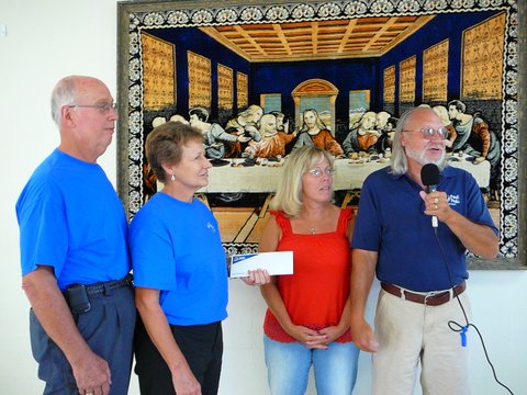 Skip and Martha Lambdin accept a donation from the motorcycle ride organized by Bob and Anita Seybold of Paoli Peaks, August 2012.