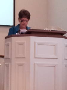 Donna Bonath reads scripture during a worship service at the Paoli United Methodist Church.