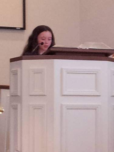 Maggie Vincent reads scripture during a worship service at the Paoli United Methodist Church.