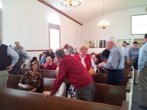Members of the Paoli United Methodist Church prepare to take the light of Christ into the world.