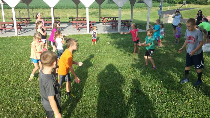 Children tossing eggs back and forth at Paoli United Methodist Church Vacation Bible School.