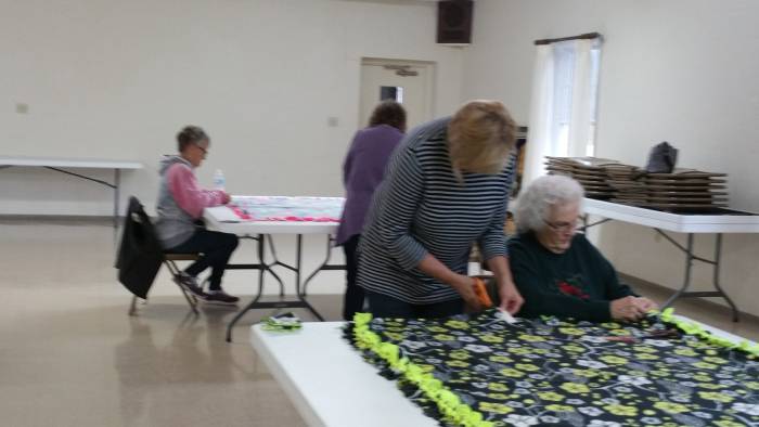 Joanne Stroud, Ann Babcock, DeeAnn Harmon, and Mary LaVerne Boston Working on the Blankets of Love mission at the Paoli United Methodist Church.
