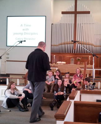 Casey Brewster presents 'A Time With Young Disciples' for the children.