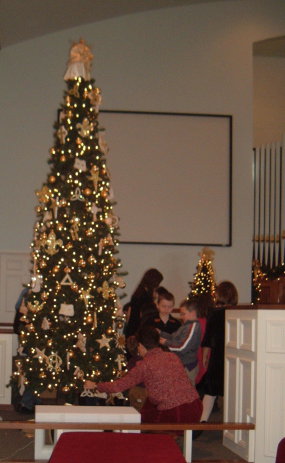 Children decorating the tree with Chrismons at the Paoli United Methodist Church.