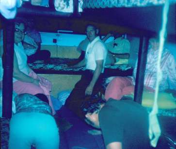 People in the dark on board God's Nightcrawler, an overnight church bus.