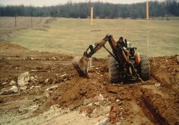 Backhoe excavating at a construction site.