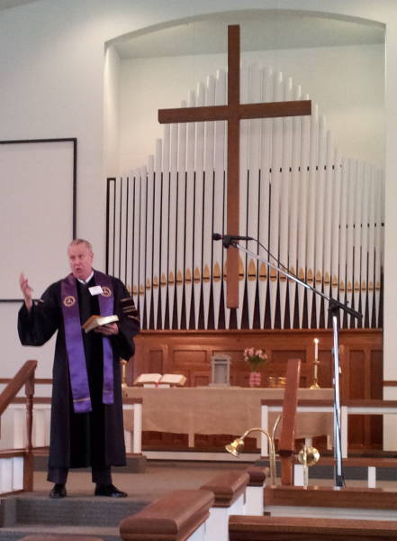 Pastor LaMont Bonath with the pipe organ in 2015.