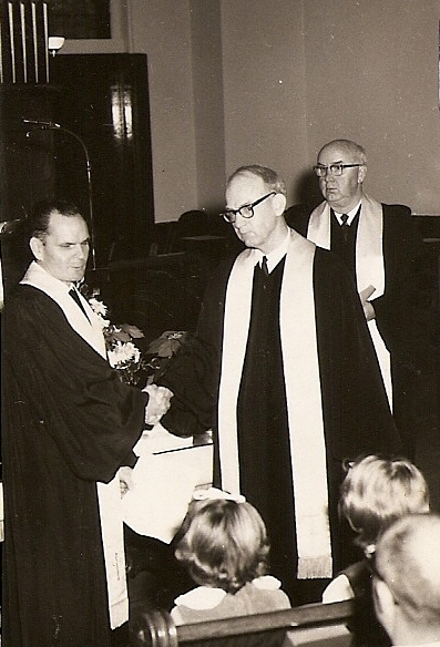 John Russell and Richard Gillum at the merger ceremony in December, 1968.