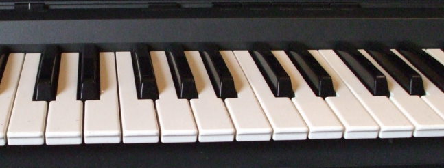 Two octaves of an electric piano keyboard.
