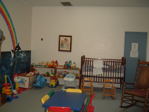 Crib, chairs and toys in the nursery (ages 0-3).