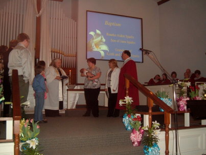 Infant being baptized by sprinkling at the Paoli United Methodist Church.