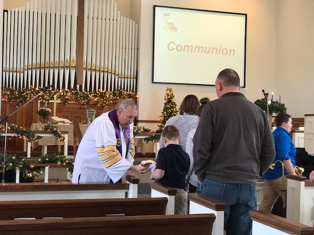 The congregation takes Communion at the Paoli United Methodist Church.