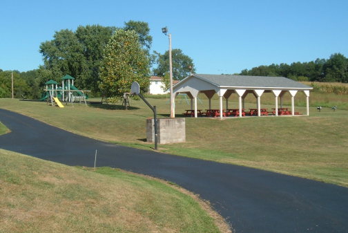 Children's playground and shelter house for outdoor dining.