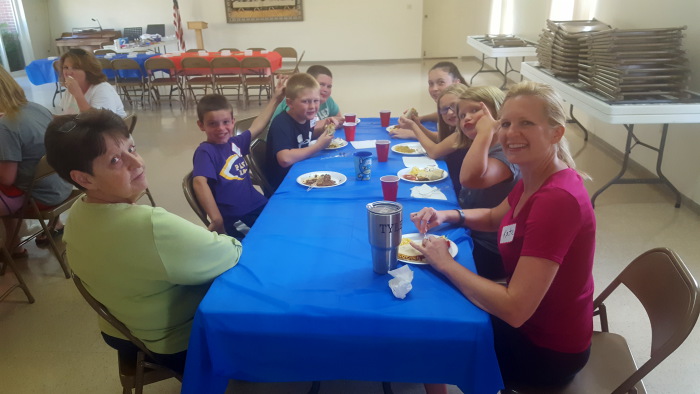 Children eating dinner at Vacation Bible School.