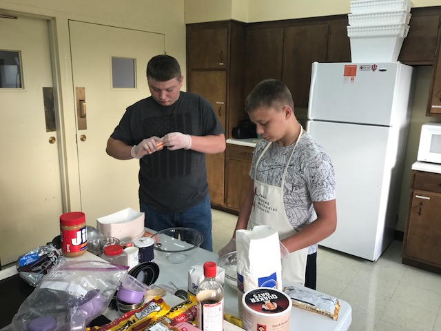Paoli UMC Jr/Sr High class baking cookies for care packages for college students.